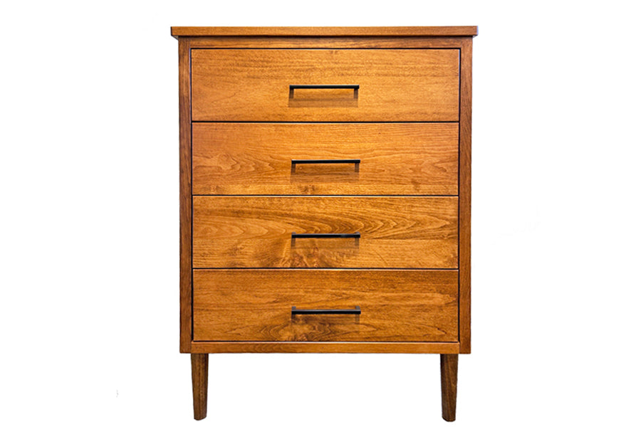 A mid-century modern wooden chest of drawers with long, tapered legs and a series of horizontal drawers, made from solid maple or oak wood. 